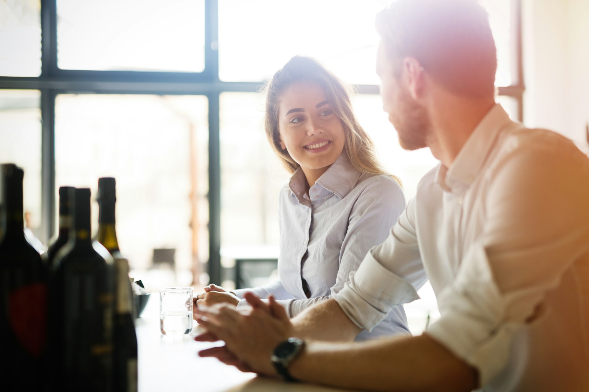 Business colleagues dating in restaurant