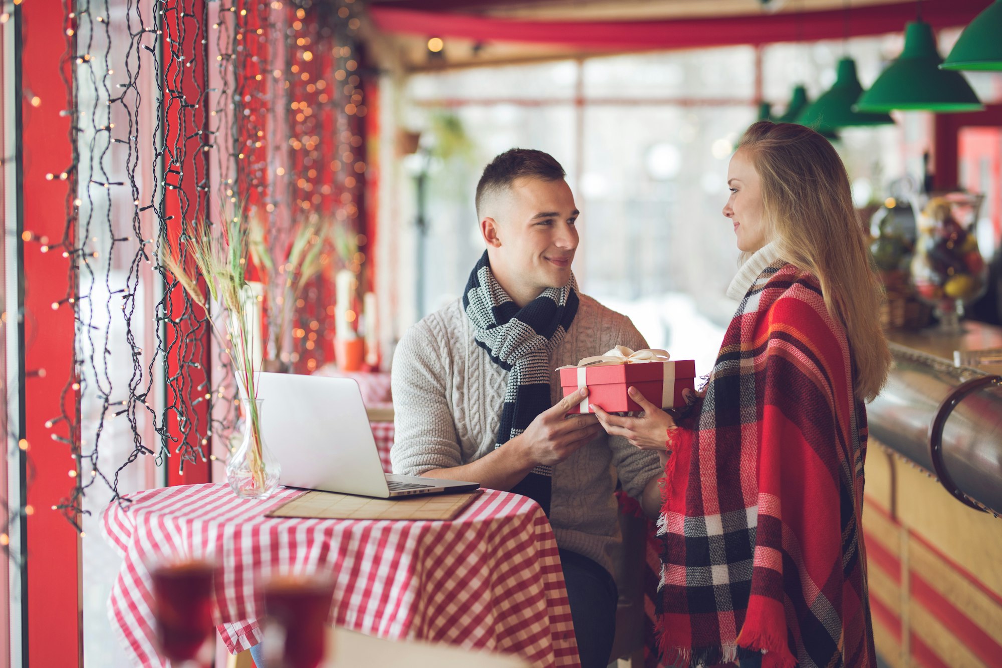 Smiling couple with a gift on a date